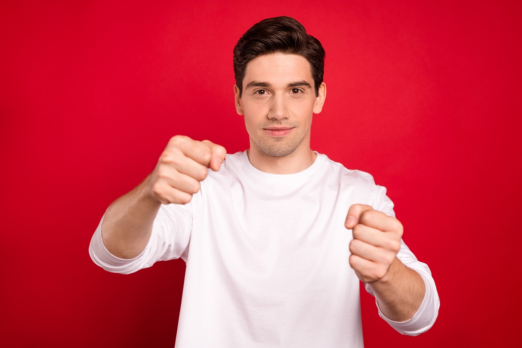 Texas Defensive Driving photo portrait brunet guy in white shirt imagine driving car steering wheel isolated vivid red color background
